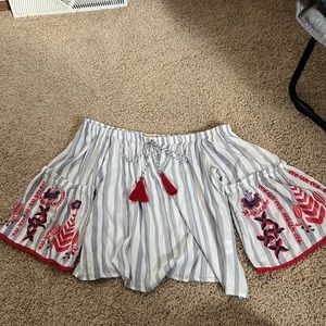 Blue and white striped sleeveless shirt